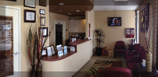 Reception desk and patient waiting area at Smileworld Family Dental in Cupertino, CA